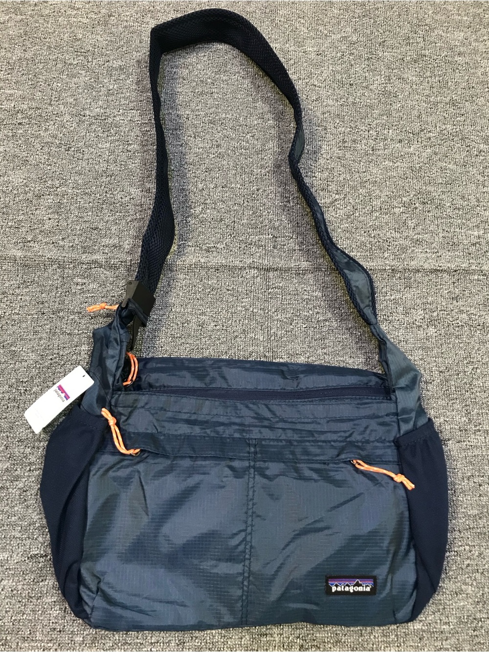 Patagonia Navy Blue Crossbody Travel Bag with Orange Accents